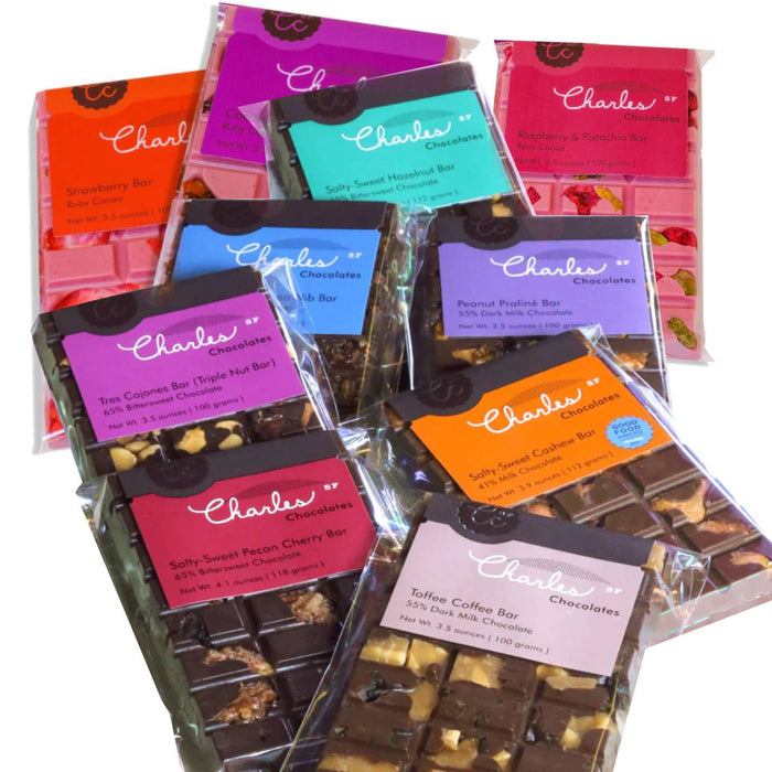 A spread of Charles Chocolates handmade artisan bars in their wrappers