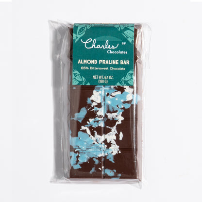 Almond French Praline Crunch Bar in its teal botanical wrapper by Charles Chocolates