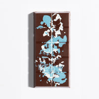 Unwrapped Almond Praline Crunch Bar with blue cocoa butter splatter on dark chocolate