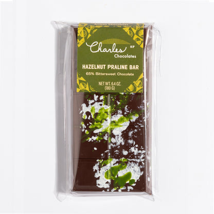 Hazelnut French Praline Crunch Bar in its olive botanical wrapper by Charles Chocolates