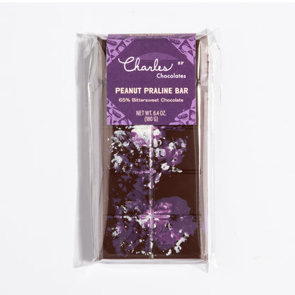 Peanut French Praline Crunch Bar in its purple botanical wrapper by Charles Chocolates