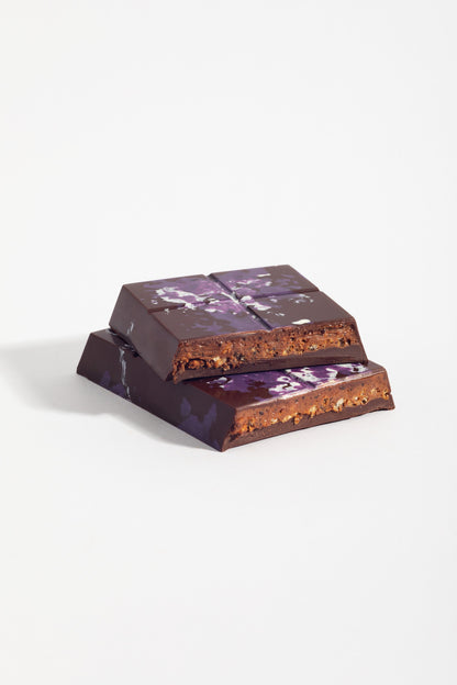 Stacked squares of Peanut French Praline Crunch Bar showing the crisped praline filling