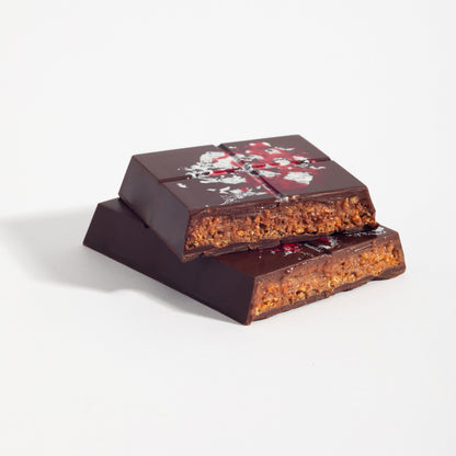 Stacked squares of Pecan French Praline Crunch Bar showing the crisped praline filling