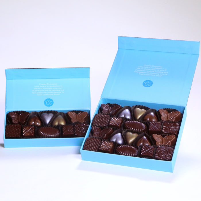 Charles Chocolates signature assortment box in blue packaging, open, showing assorted pieces